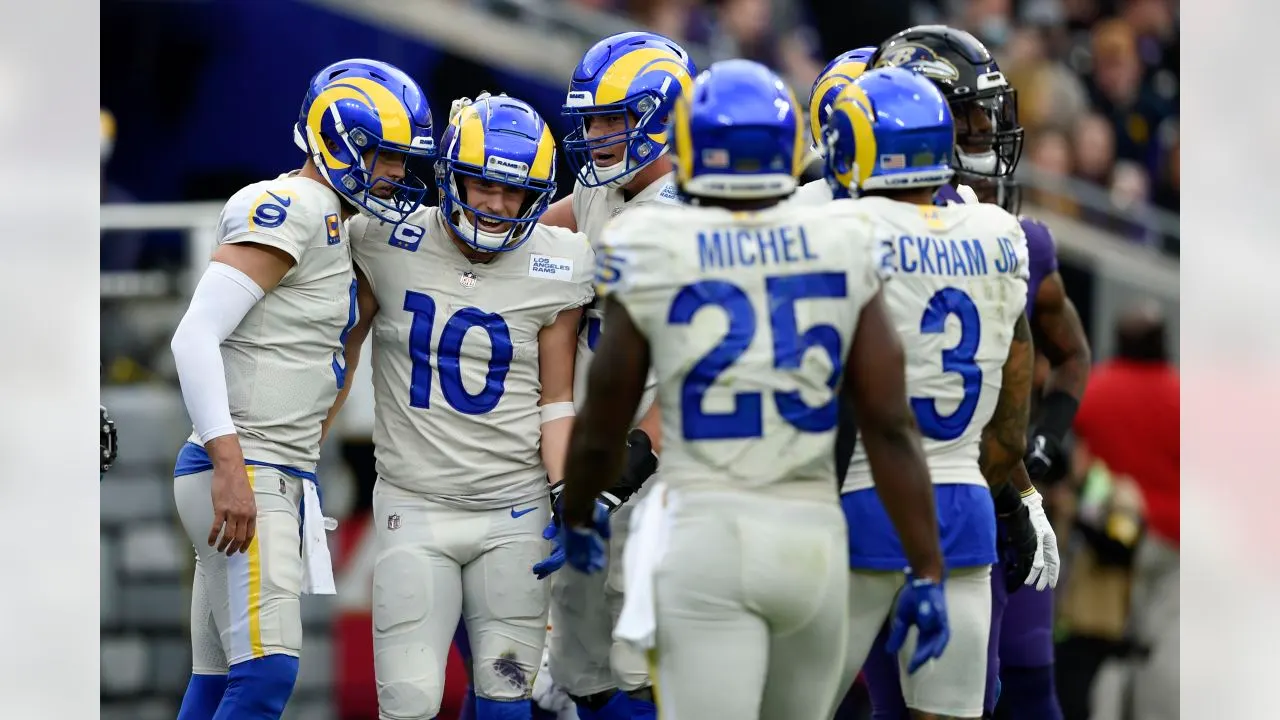 Los Angeles Rams wide receiver Cooper Kupp (10) and quarterback Matthew Stafford (9) are joined by teammates after they connected for a touchdown pass against the Baltimore Ravens during the first half of an NFL football game, Sunday, Jan. 2, 2022, in Baltimore.